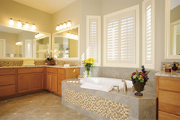 Bathroom with large tub and vanity
